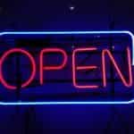 A neon sign says OPEN.