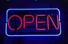 A neon sign says OPEN.