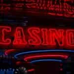 A neon sign shows the word Casino in blue and red lights.