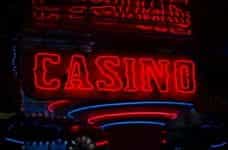 A neon sign shows the word Casino in blue and red lights.