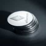 Silver Ethereum cryptocurrency coins.
