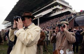 Racegoers watch the action at Cheltenham