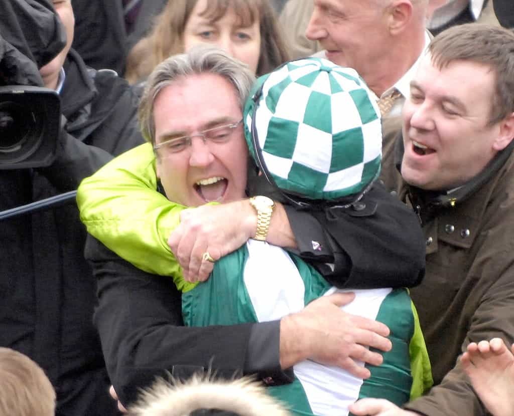 Harry Findlay celebrates with his jockey after Denman had won the Gold Cup.