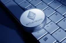 Ethereum coin on keyboard.
