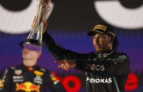 Lewis Hamilton hold his Aaudi Arabian Grand Prix trophy aloft.