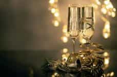 Champagne flutes with Christmas decorations.