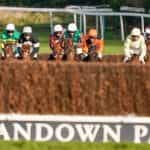 National hunt horses racing at Sandown Park.