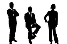 Three silhouetted figures in corporate business attire.