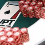 Chips neatly stacked on a WPT branded poker table..