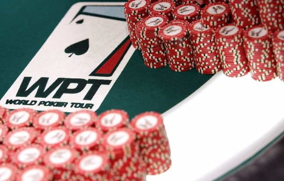 Chips neatly stacked on a WPT branded poker table..