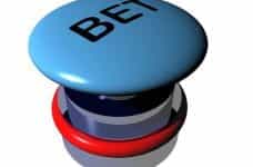 A large blue button with the word BET written on the top in large bold letters.