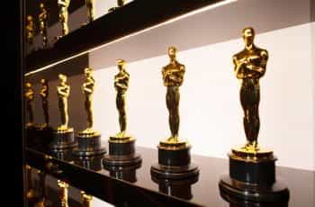Academy Award Oscar trophies neatly displayed.