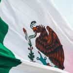 A close up of the Mexican flag waving.