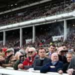 Huge crowds in the Cheltenham grandstands waiting for race action to start.