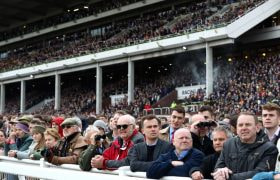 Huge crowds in the Cheltenham grandstands waiting for race action to start.