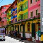 A street in Colombia with many colorful buildings.