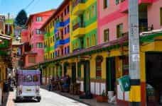 A street in Colombia with many colorful buildings.