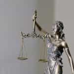 A statue of Lady Justice with her blindfold and scales.