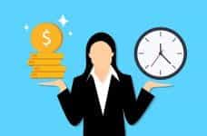 A graphic of a woman in a suit holding a stack of coins in one hand and a clock in the other.