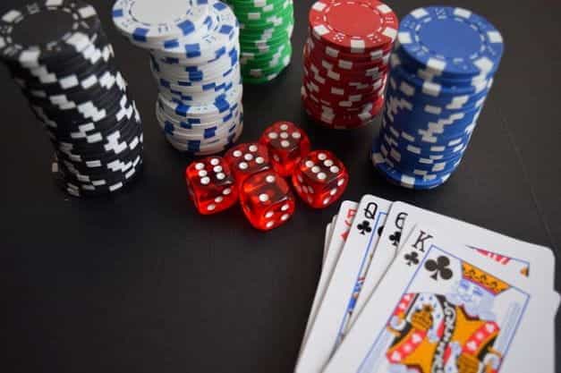 Playing cards, dice and poker chips.