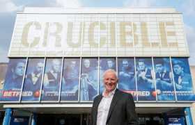 Barry Hearn standing outside of Sheffield’s Crucible Theatre during the 2022 World Snooker Championship.