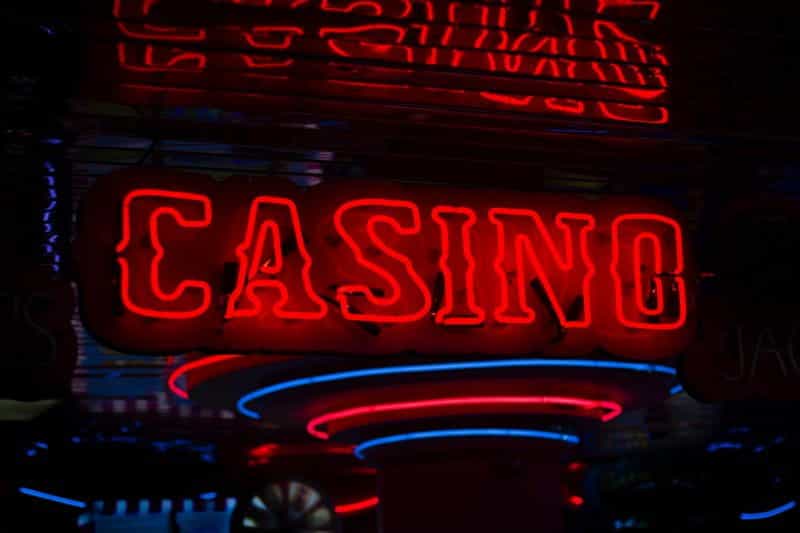 A neon sign shows the word CASINO in red.