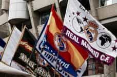 Real Madrid football club flags on a stadium.