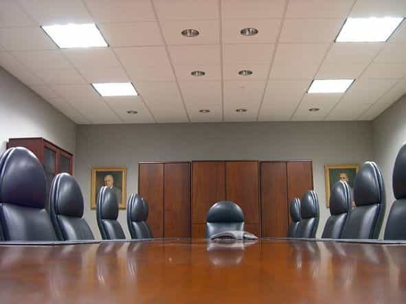 Board room table with ten chairs.