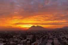 Mountains behind the city of Cerro in Monterrey, Mexico during sunset.