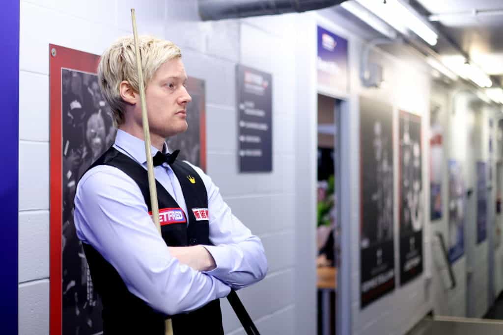 Neil Robertson, stood in a Crucible corridor, ahead of a 2022 World Snooker Championship match.