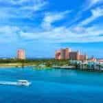 The Atlantis Paradise Island casino-resort against a blue sky on a sunny day in the Bahamas.