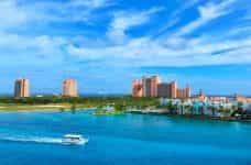 The Atlantis Paradise Island casino-resort against a blue sky on a sunny day in the Bahamas.