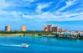 The Atlantis Paradise Island casino-resort against a blue sky on a sunny day in the Bahamas.