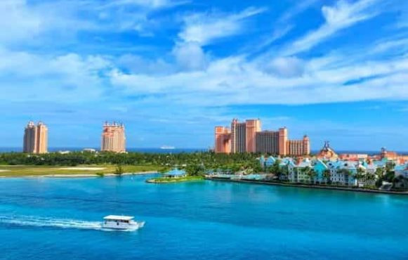 The Atlantis Paradise Island casino-resort against a blue sky on a sunny day in the Bahamas.