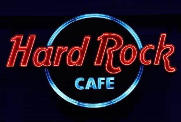 The highly recognizable and world-famous Hard Rock Café sign in red and blue neon lettering.