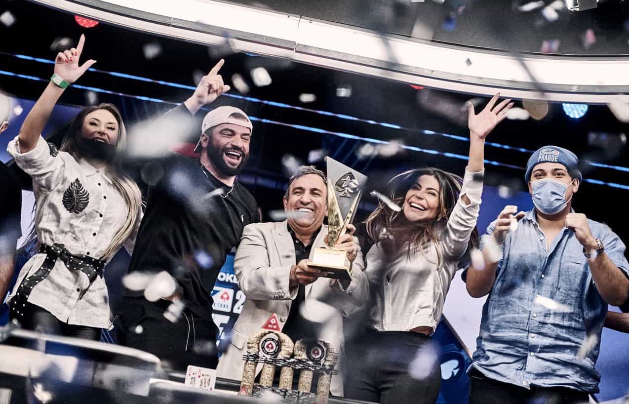 Marcelo Mesqueu and friends pose for the cameras after his victory in the 2022 Monaco EPT Main Event.