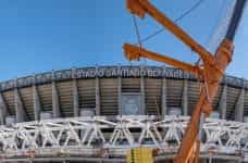 Outside of a football stadium with the words Estadio Santiago Bernabéu.