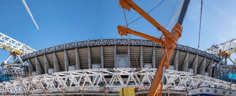 Outside of a football stadium with the words Estadio Santiago Bernabéu.