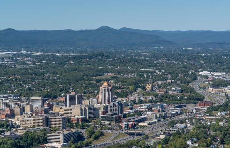 The city of Roanoke, Virginia, with the Blue Ridge Mountains seen off in the distance.