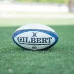 A rugby ball on grass.