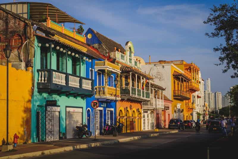Colorful buildings line a street in Colombia.
