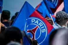 A blue and red flag bearing the symbol of French football club Paris Saint-Germain.
