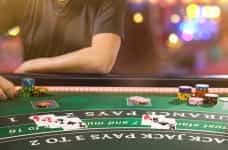 A gambler sat at a blackjack table.