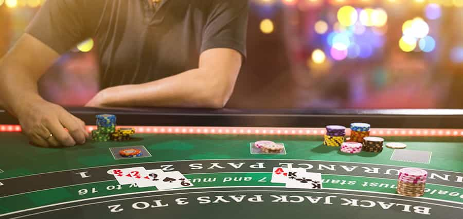 A gambler sat at a blackjack table.