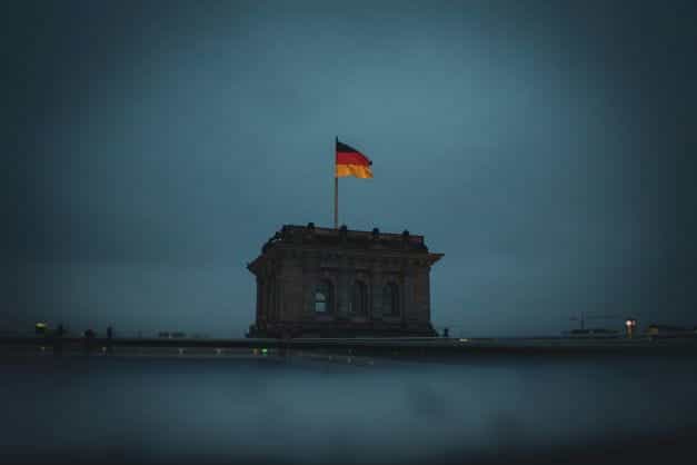A German flag on top of a building.