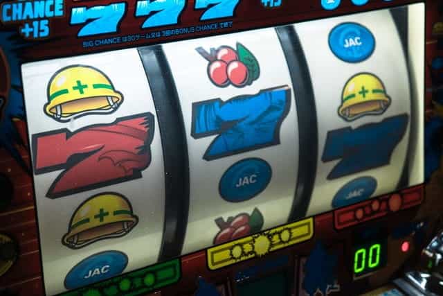 A slot machine displays 7s and other icons.