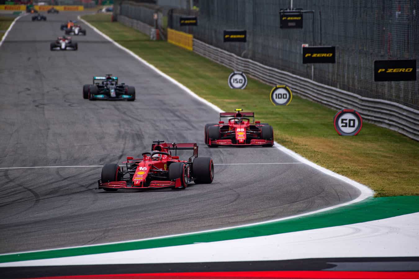 Both Ferrari cars in action at the 2021 Italian Grand Prix.