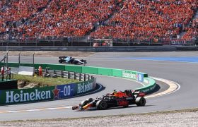 Sergio Perez racing before packed grandstands at the 2021 Dutch Grand Prix.