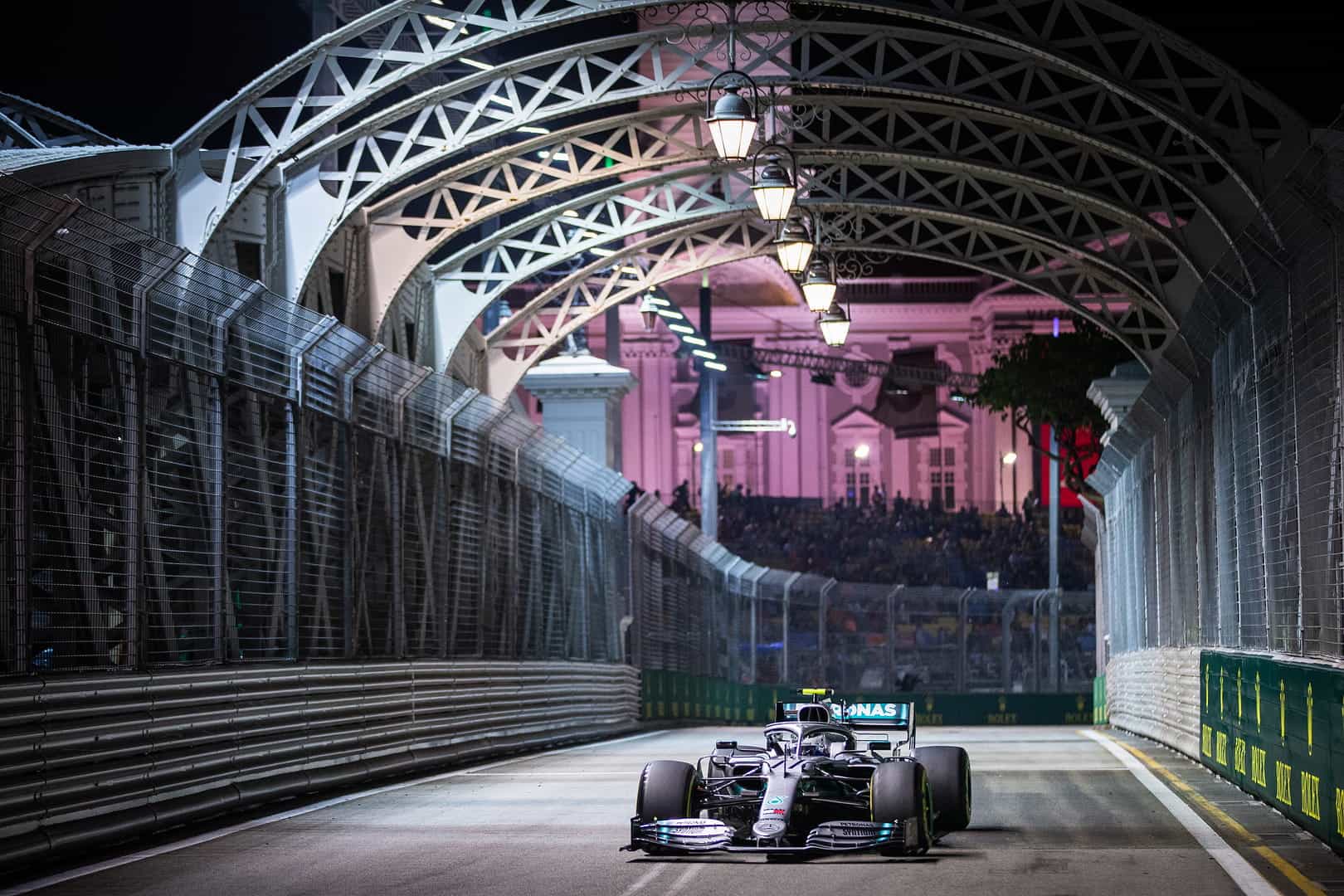 Lewis Hamilton racing his Mercedes at the Singapore Grand Prix.