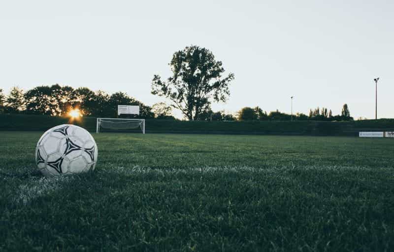 A football on an empty pitch.